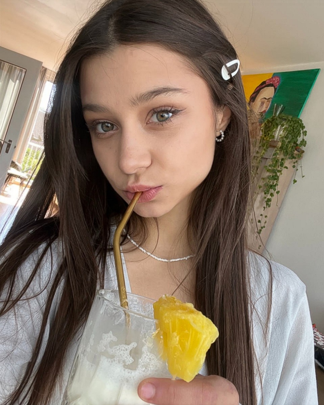 Sipping a pineapple drink